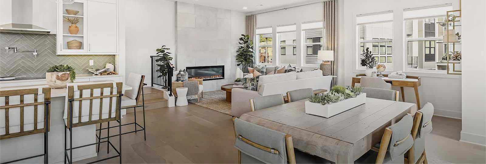 Deep house cleaning professional in a bright Seattle home kitchen and living area.