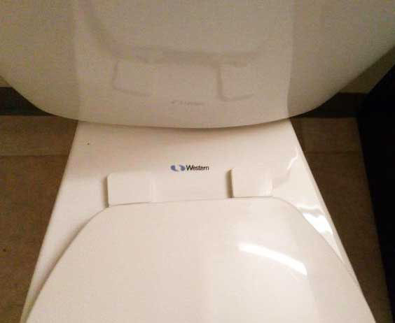 White Western-brand toilet completely clean, shiny, and sanitized after professional deep bathroom cleaning in Bellevue.