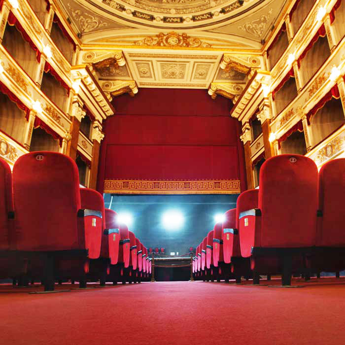 Seattle theater interior with clean seating, aisles, and stage area