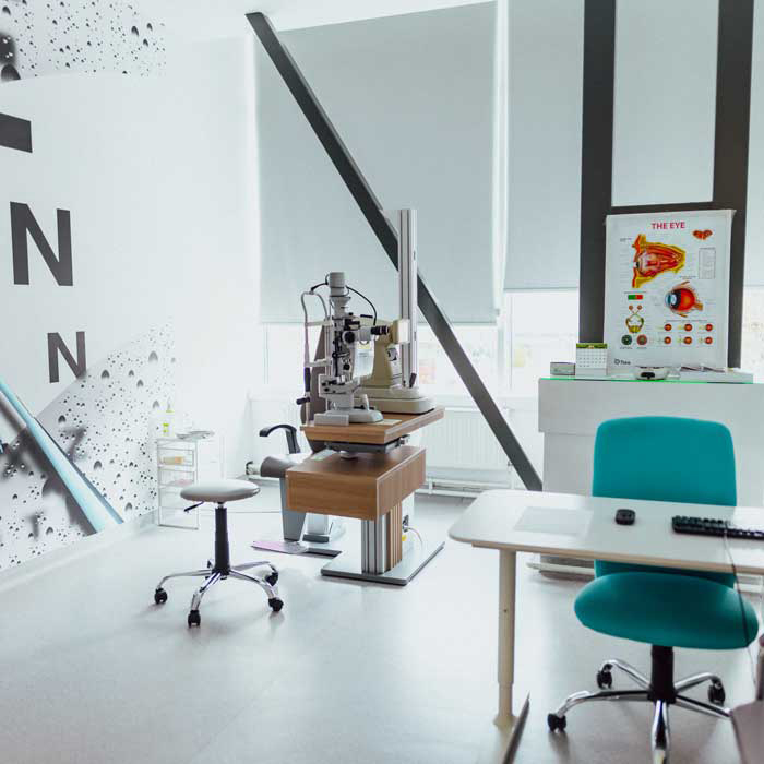 Clean optometry clinic waiting area with organized reception space