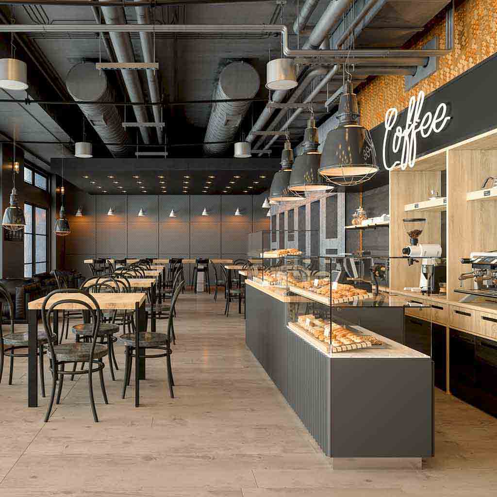 A clean, modern coffee shop interior with neatly arranged seating, polished floors, and clear counters, photographed between service periods in Seattle