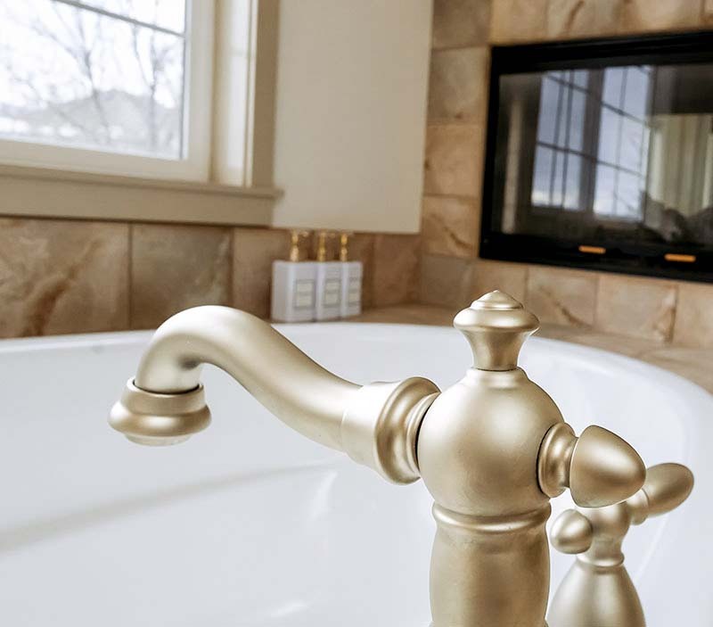 Brushed nickel faucet on a soaking tub in a Seattle home prepared for move-in cleaning by Simply Clean